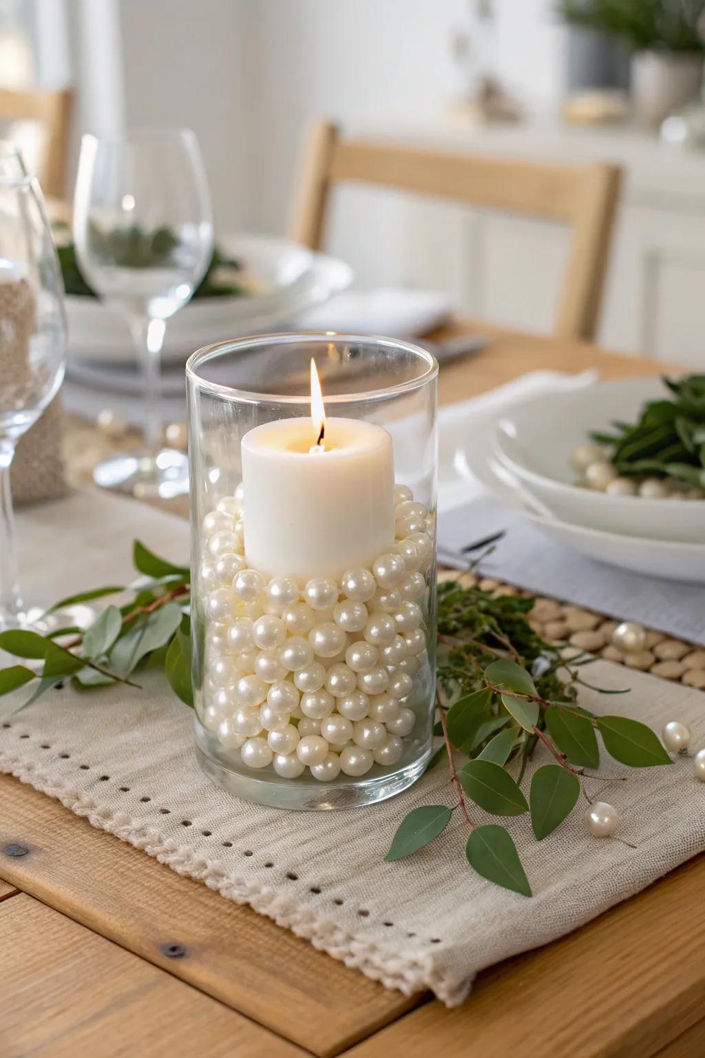 Create a magical ambiance with glass vases filled with pearls and topped with candles.